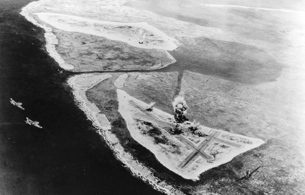 Diorama by Norman Bel Geddes, depicting the the Japanese carrier air attack on Midway in the morning of 4 June 1942. Two Type 00 carrier fighters are at left. Eastern Island airfield is under attack in lower center. Sand Island is in the upper left center, with hits visible in the vicinity of the seaplane hangar. Official U.S. Navy Photograph, now in the collections of the National Archives.